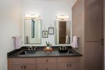 The primary bathroom features a double vanity.